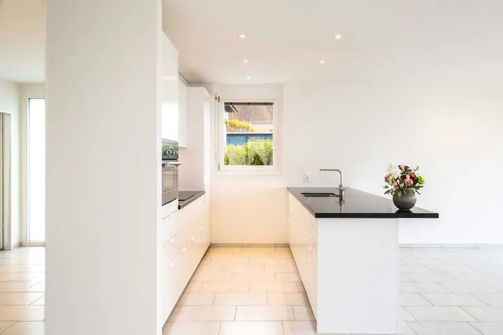 Fitted kitchen with sink and cabinetry by Bath Kitchen Fitters