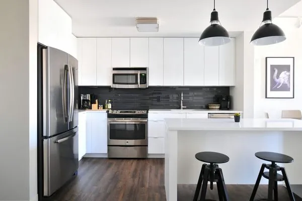 Modern fitted kitchen next to a window in a Bath home
