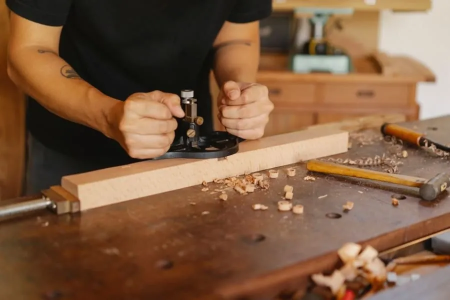 Cabinet maker building a bespoke larder cupboard in a workshop