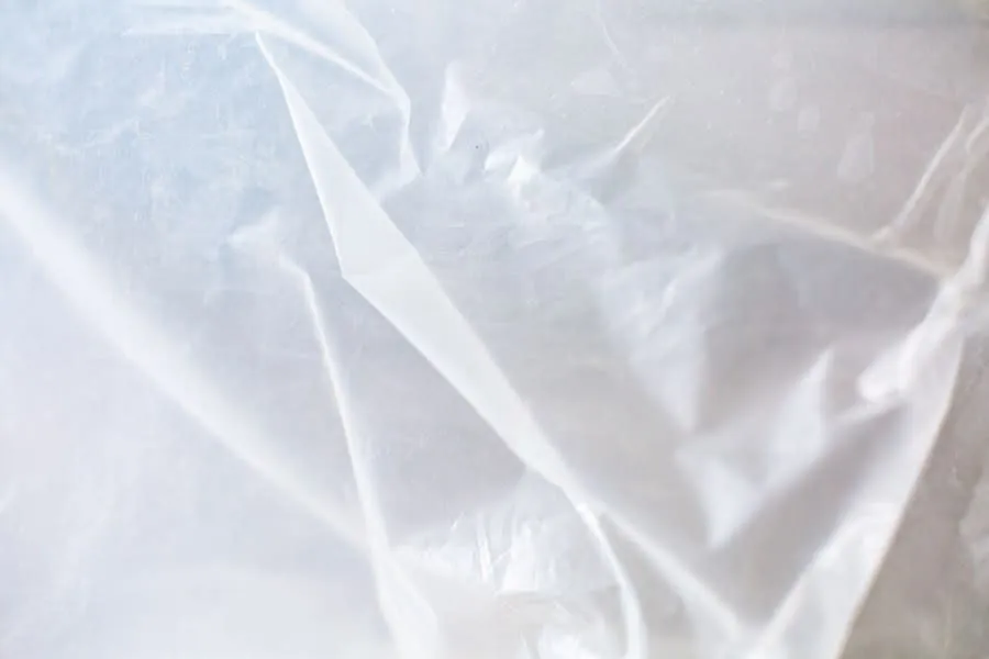 Plastic sheeting protecting a doorway during a kitchen strip-out in Bath