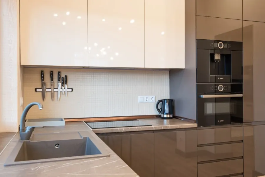 Fitted Bath kitchen with integrated appliances behind cabinet doors