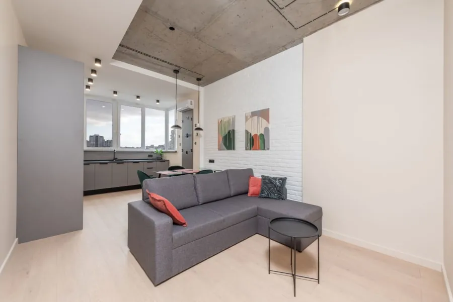 Kitchen zoned with a half-wall and dining area in a Bath home