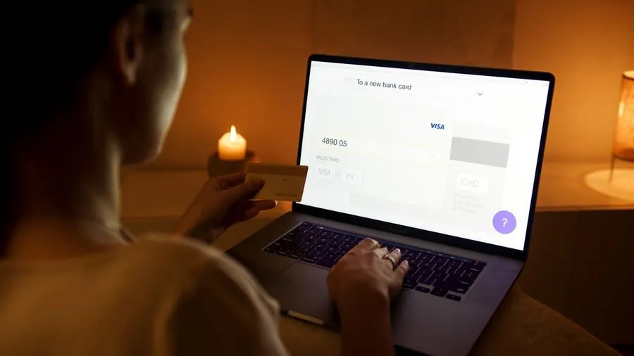 Homeowner making the final payment for a kitchen installation online
