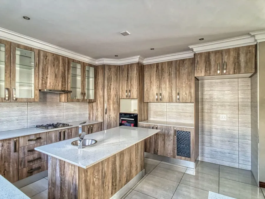Kitchen fitter installing units during a Bath kitchen renovation