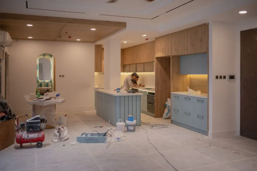 Kitchen units being installed during a Bath fitting