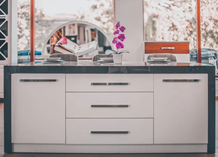 Kitchen island with deep storage drawers in a Bath home