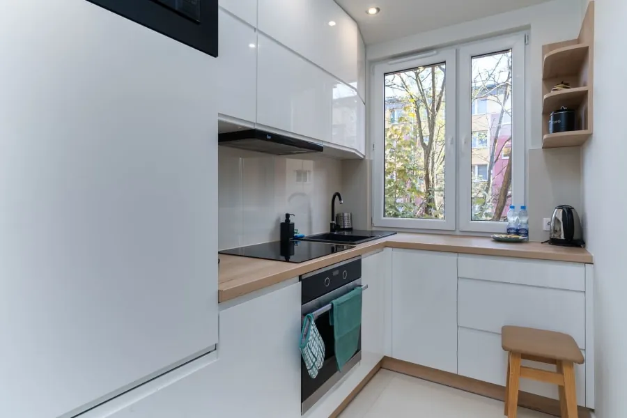 Small kitchen layout planned around period features in a Bath home