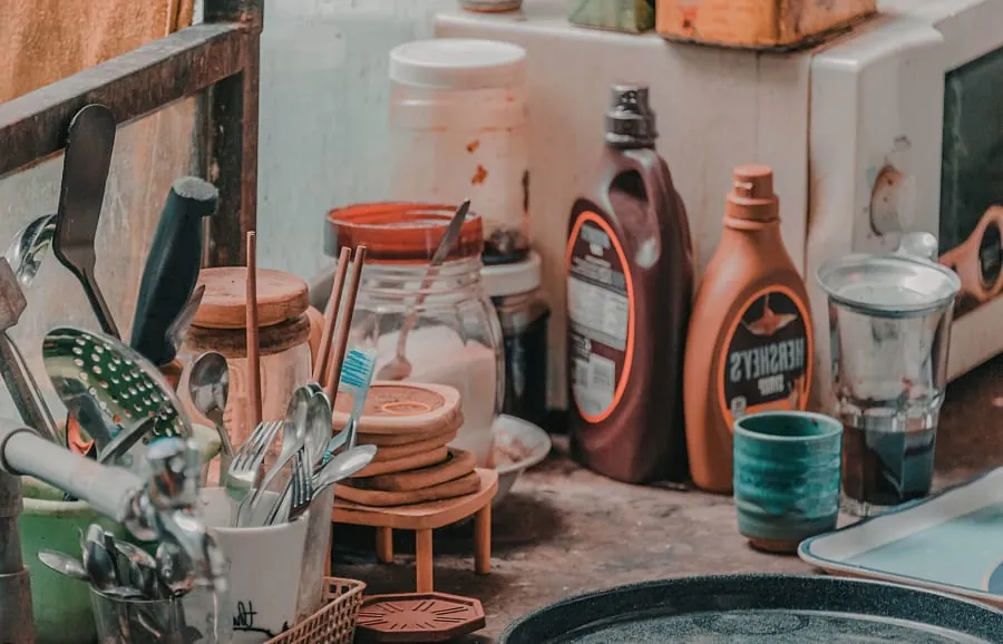 Cluttered kitchen worktop from poor storage planning in a Bath home