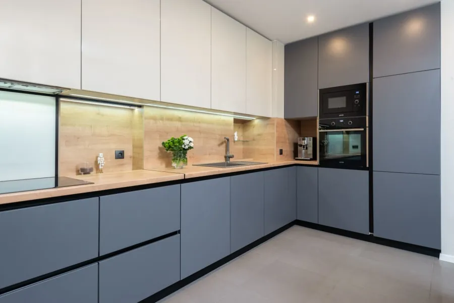 Kitchen arranged around the sink, hob and fridge work triangle in a Bath home