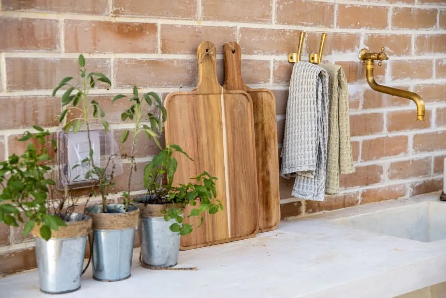 Sage green kitchen units in a Bath home