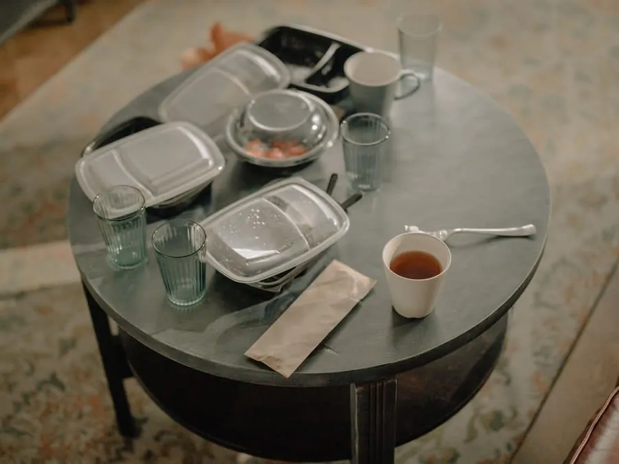 Takeaway containers on a table during a kitchen renovation in a Bath home