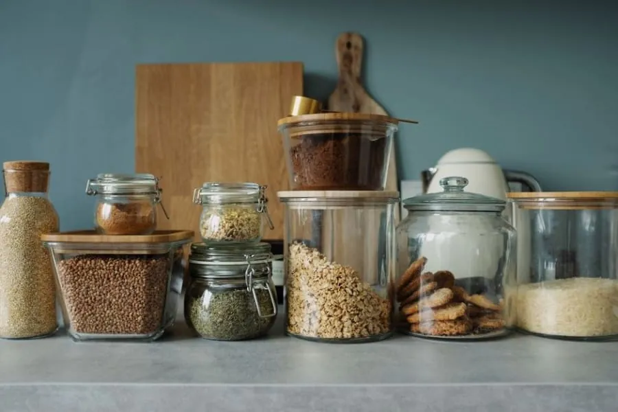 Walk-in pantry with open shelving compared with a fitted larder cupboard